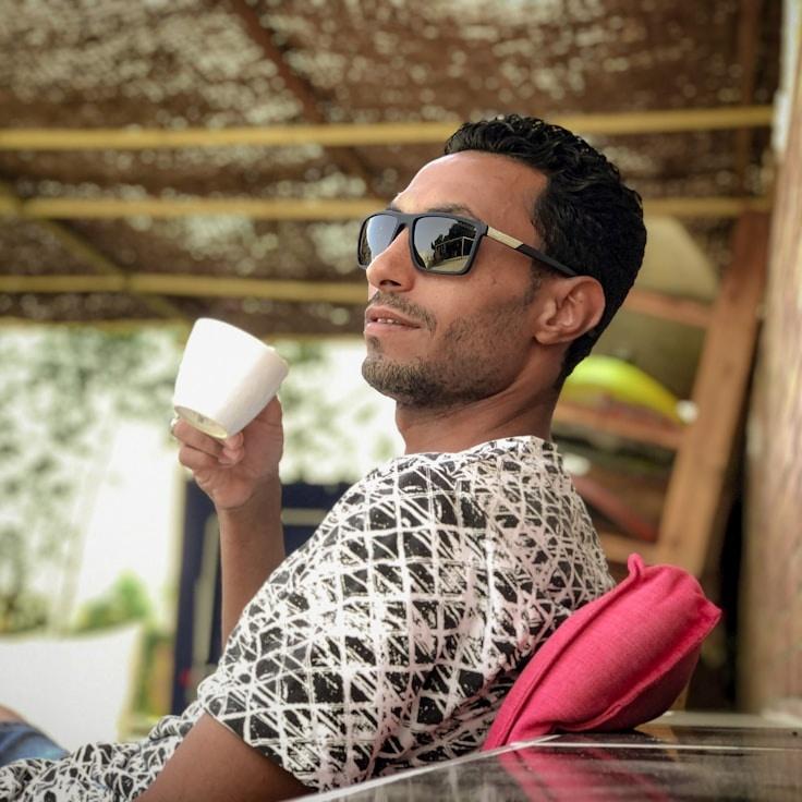 Kaveri Mehta, Lead Design Curator at RiverCommonsLedgerWood, reviewing corporate floral arrangements